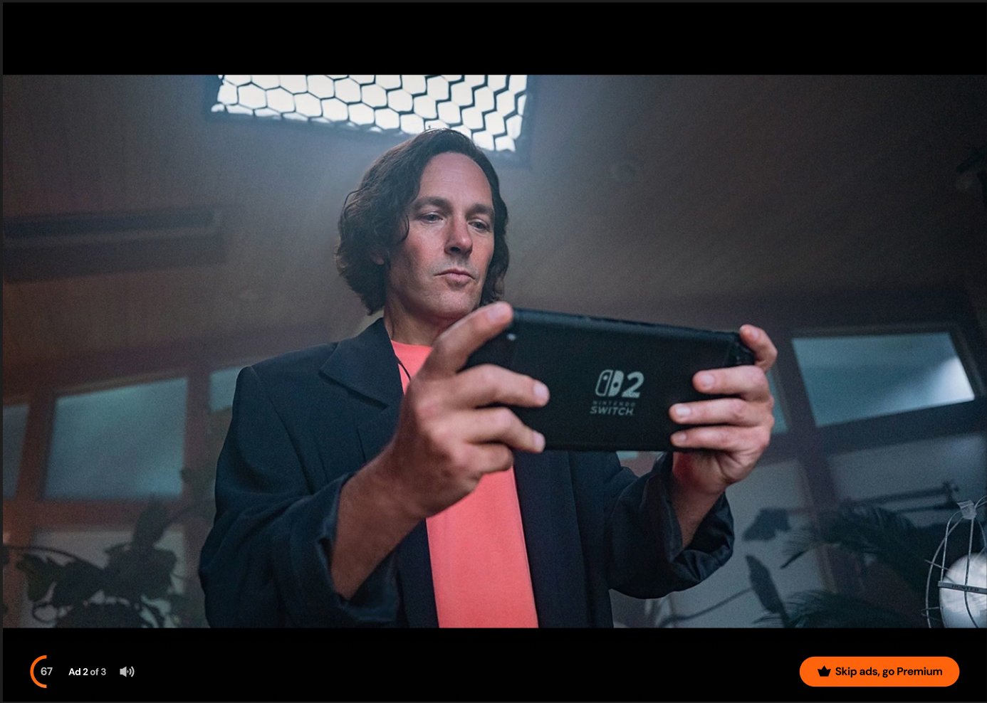 Web player showing Ad 2 of 3 with skip CTA and Premium upsell